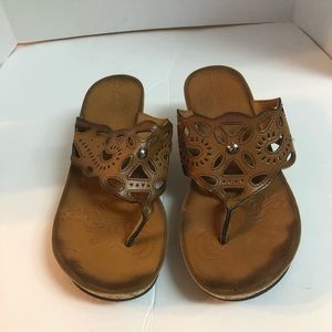 Clark’s leather thong open toe wedge heel sandals.